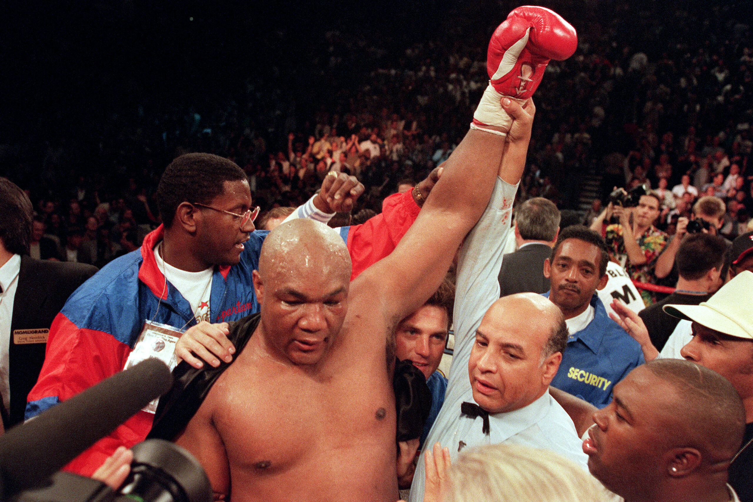 Foreman raises his hand after knocking out Michael Moorer in 1994.